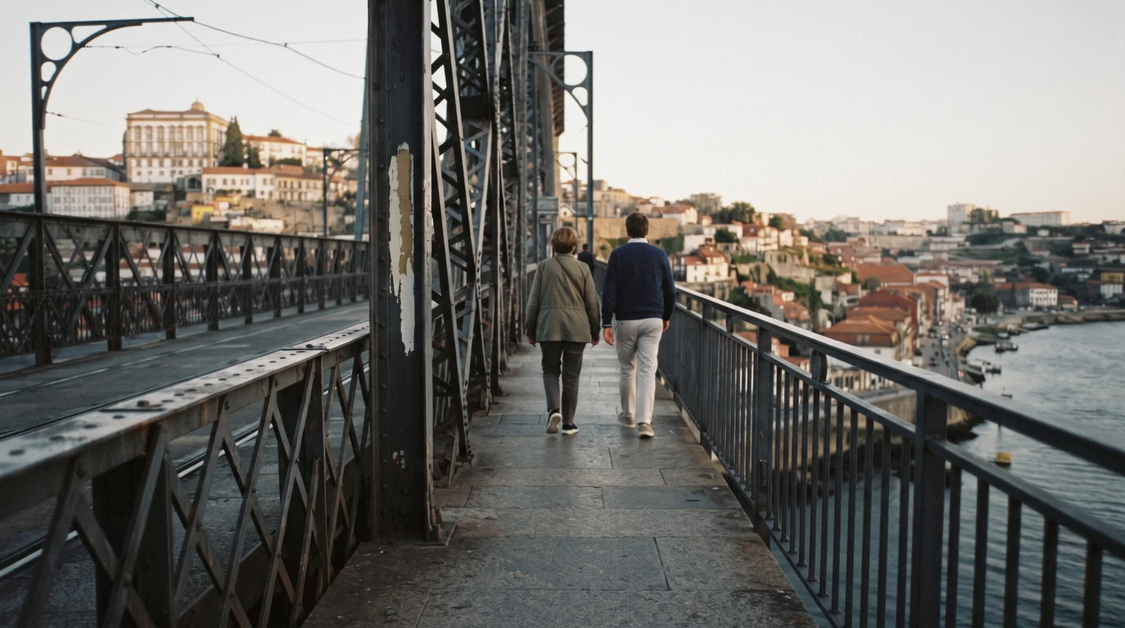The Douro and the Ribeira rooftops seen from the free pedestrian upper deck of the Luís I bridge at seven in the evening, the best of the free things to do in Porto
