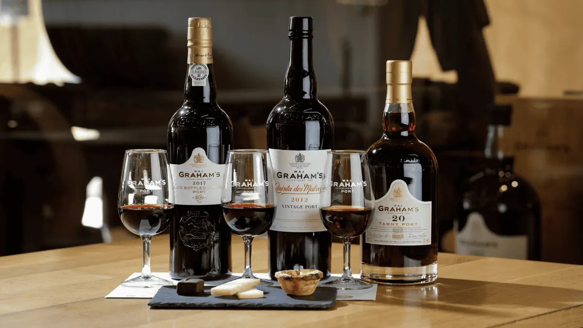 Bottles and glasses of Graham's port set out for a tasting at the lodge in Porto