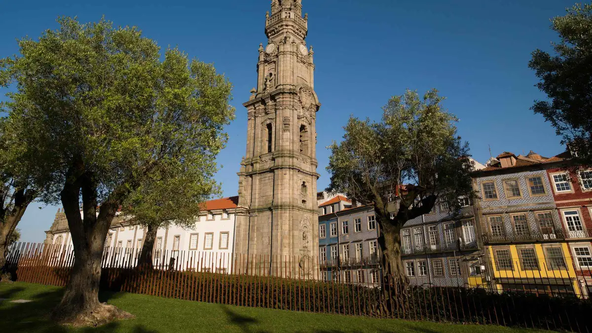 The granite baroque Torre dos Clérigos rising above the rooftops, the tower on the Porto, Portugal must-see list
