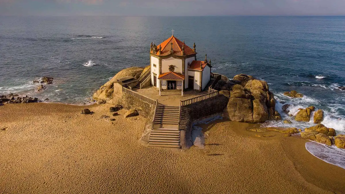 The Senhor da Pedra chapel on a rock at the edge of the beach at Miramar near Porto